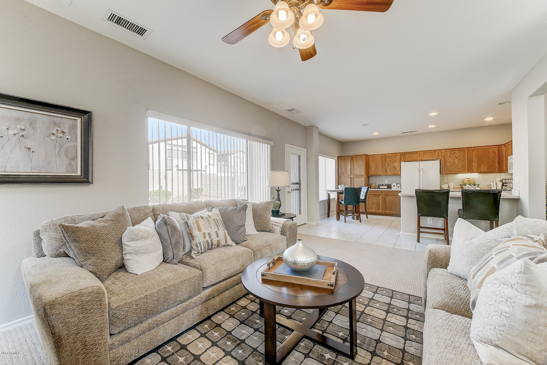 4016 East Ironhorse Road Gilbert, AZ 85297 - Photo 12 of 48 a living room with furniture and a large window