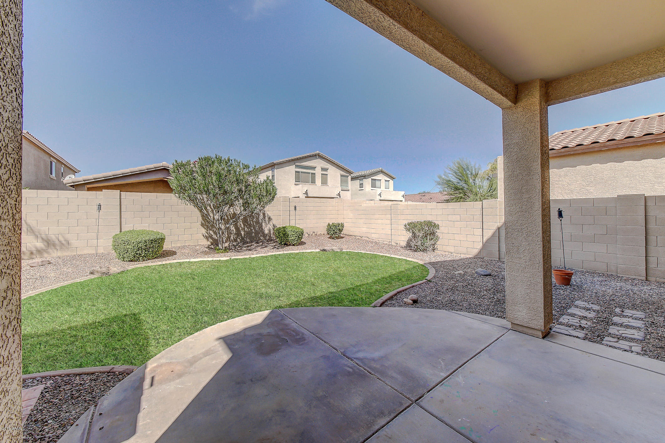 4016 East Ironhorse Road Gilbert, AZ 85297 - Photo 33 of 48 a view of a house with a yard and a fountain