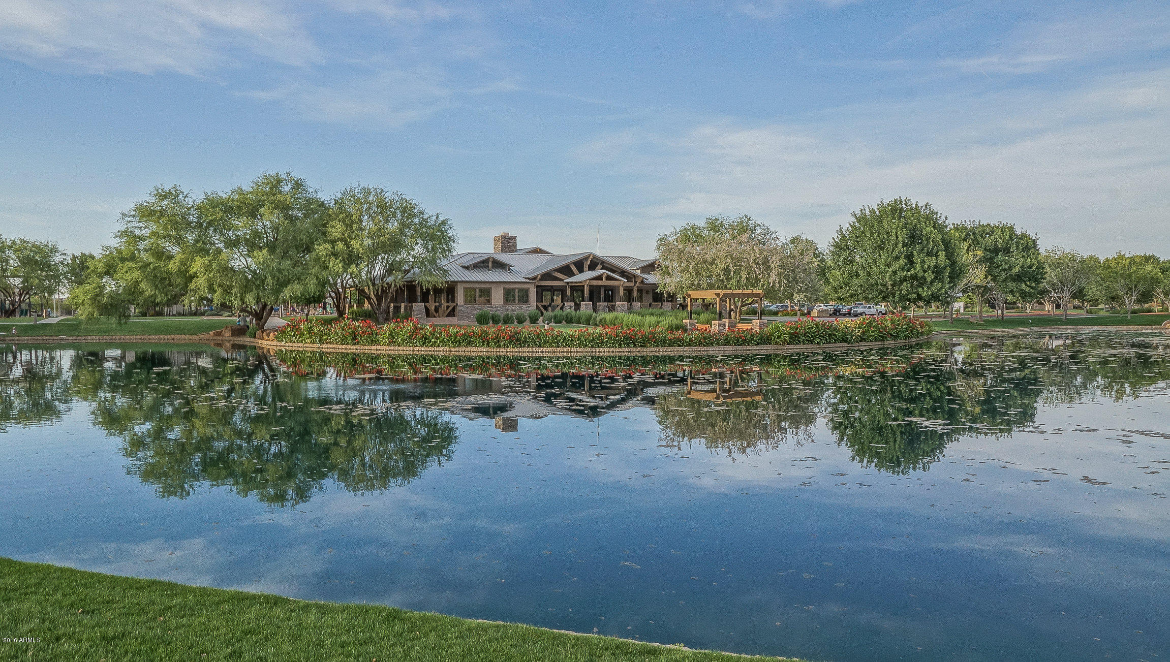 4016 East Ironhorse Road Gilbert, AZ 85297 - Photo 45 of 48 a view of a lake with houses in the back
