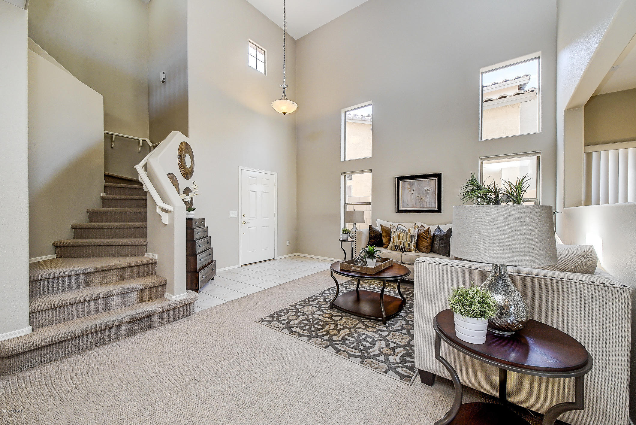 4016 East Ironhorse Road Gilbert, AZ 85297 - Photo 6 of 48 a living room with furniture and a fireplace