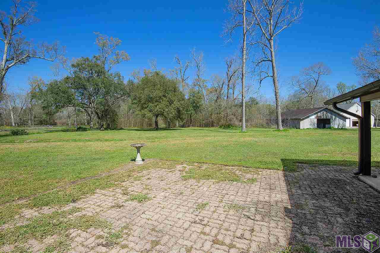 5645 Bayou Paul Road St. Gabriel, LA 70776 - Photo 15 of 16 Backyard with 6-stall Barn for horses