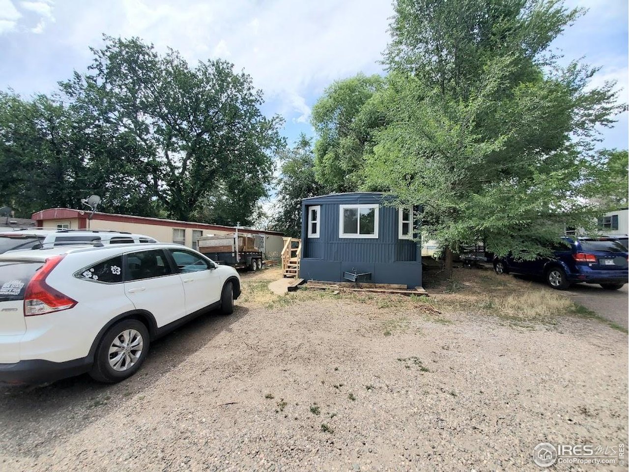 1212 Butte Road, Unit 7 Loveland, CO 80537 - Photo 21 of 21 a car parked in front of a house