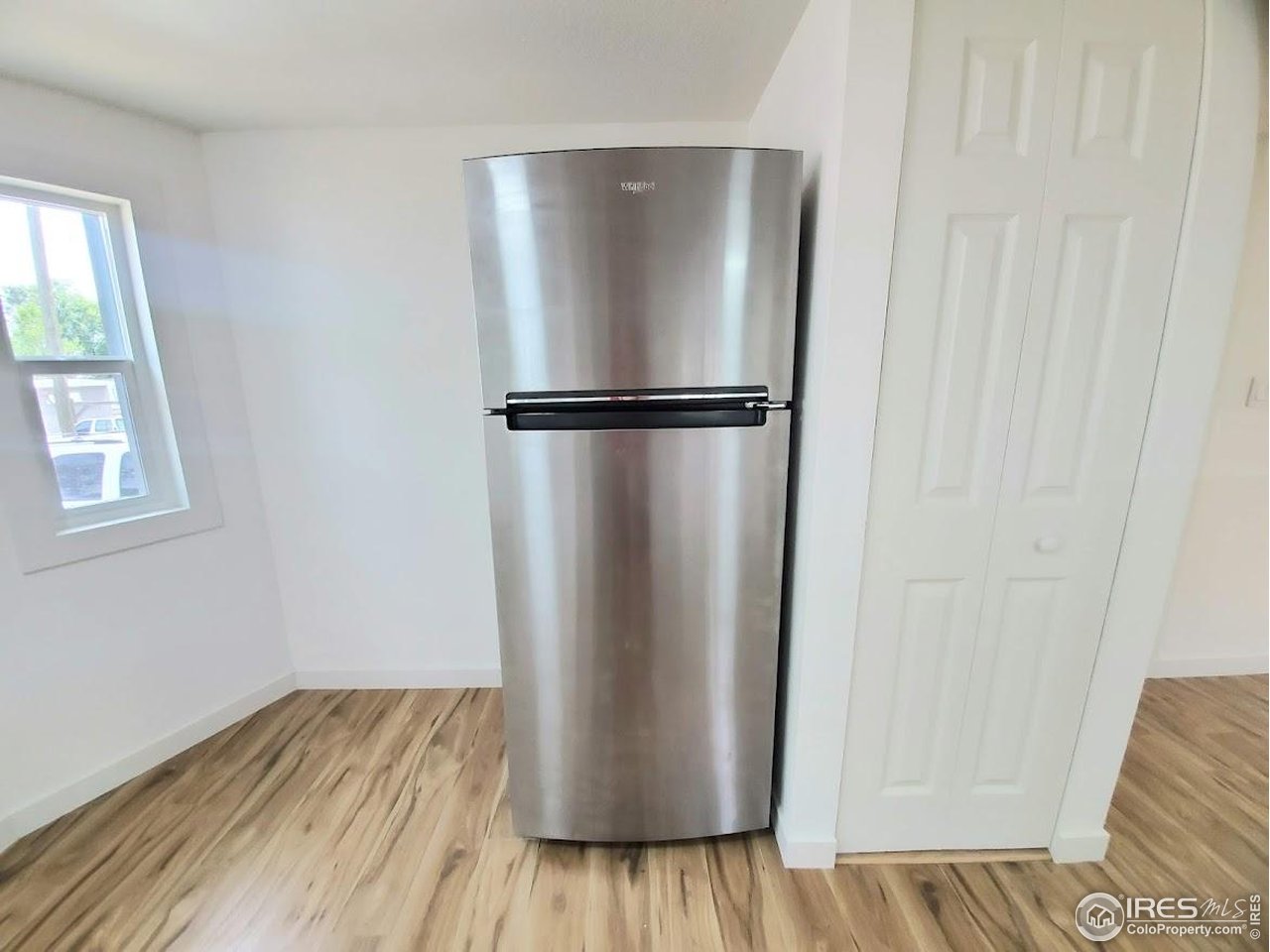 1212 Butte Road, Unit 7 Loveland, CO 80537 - Photo 10 of 21 a view of kitchen with wooden floor