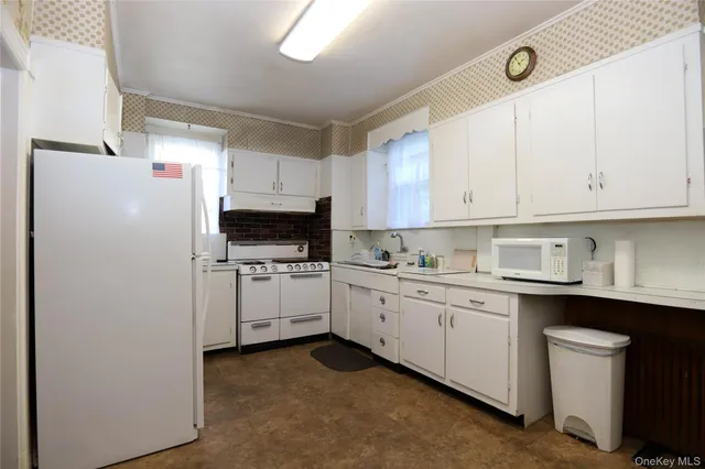 a view of a kitchen with storage and utility