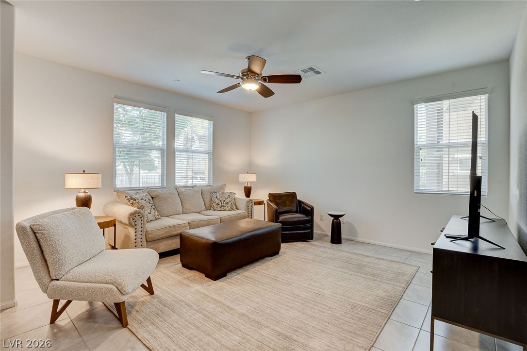484 Filaree Place Henderson, NV 89015 - Photo 11 of 71 Bright and airy living room with ample natural light, perfect for relaxation and everyday living.