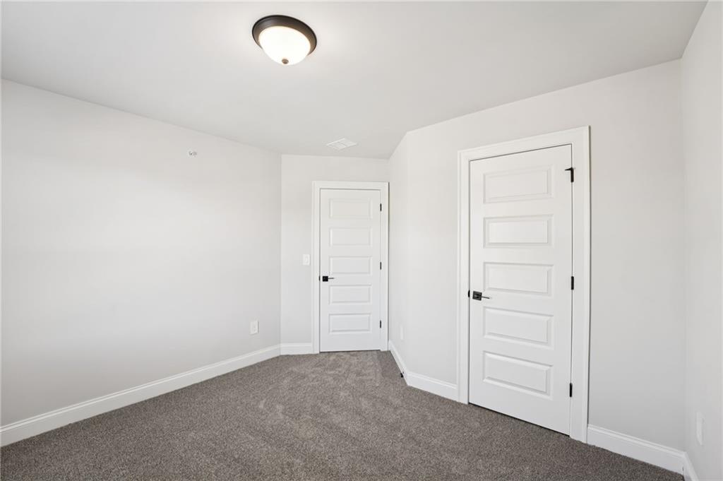 6450 Pinin Place Cumming, GA 30041 - Photo 34 of 53 a view of an empty room