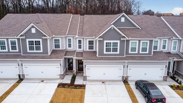a front view of a house with parking space