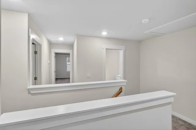 a bathroom with a bathtub and a window