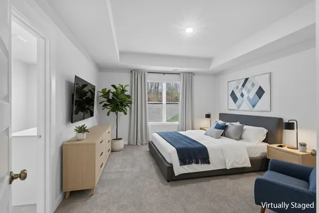 a bedroom with bed and glass door