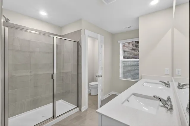 a bathroom with a bathtub and a sink