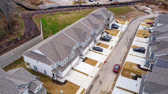 an aerial view of a house with a lake view