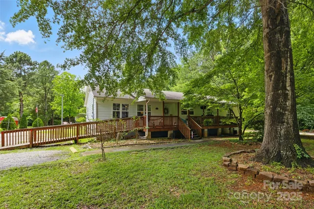 a view of balcony with couch and wooden fence
