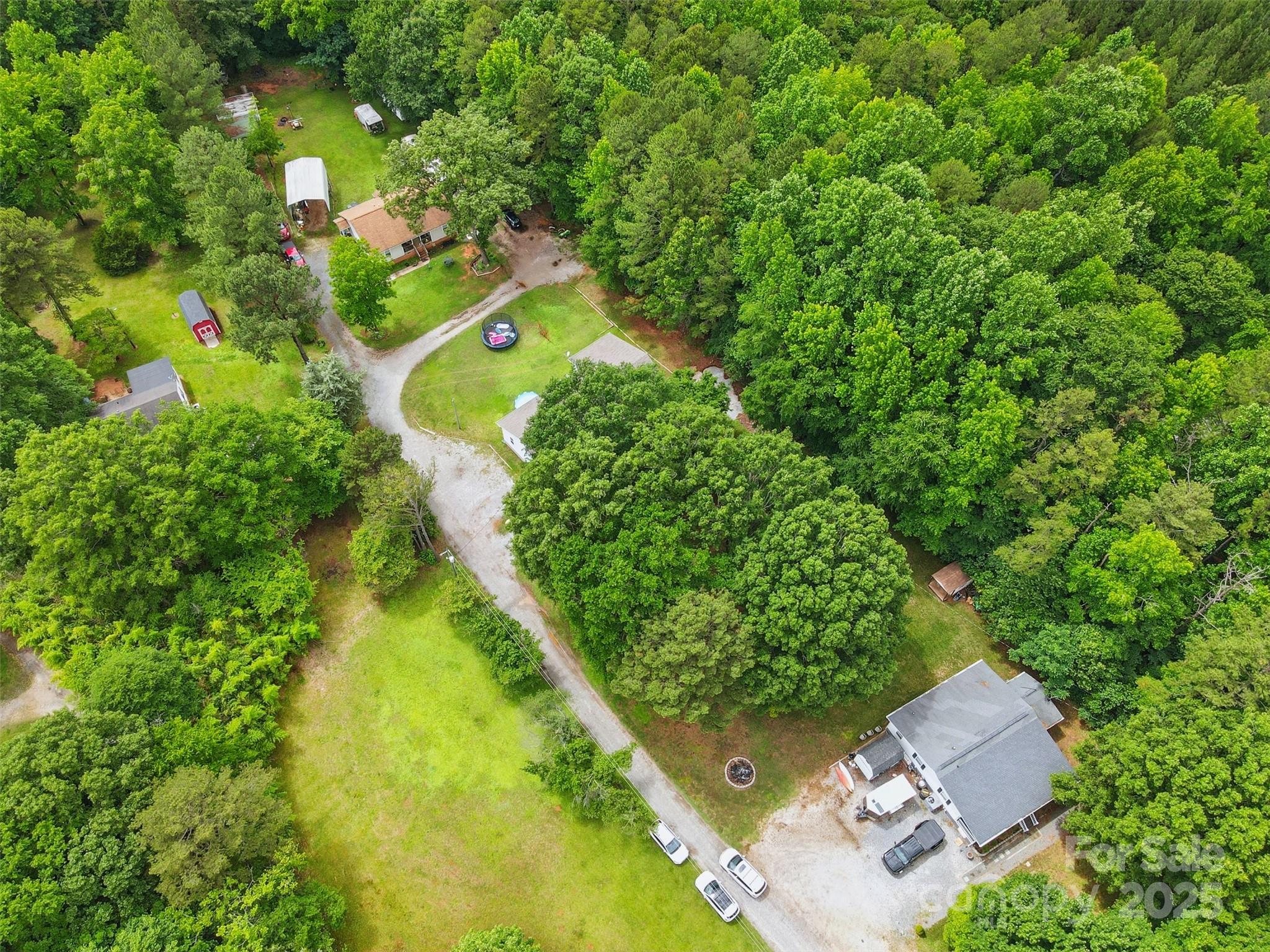 4230 Train Chaser Place Fort Mill, SC 29707 - Photo 30 of 31 an aerial view of a house with a yard and lake view