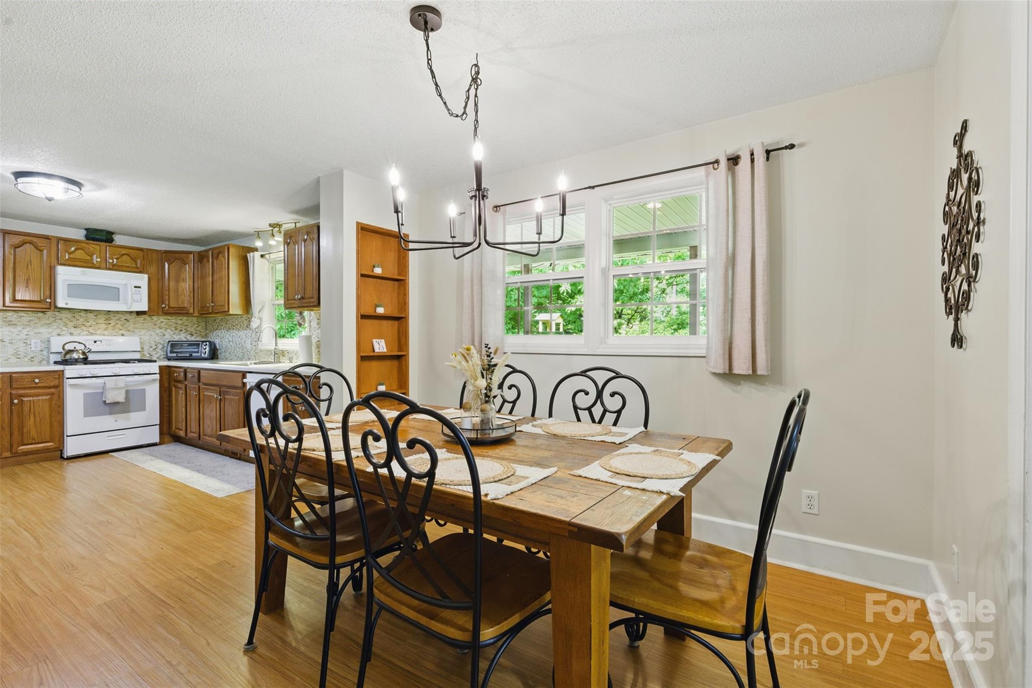 4230 Train Chaser Place Fort Mill, SC 29707 - Photo 3 of 31 a view of a dining room with furniture window and wooden floor