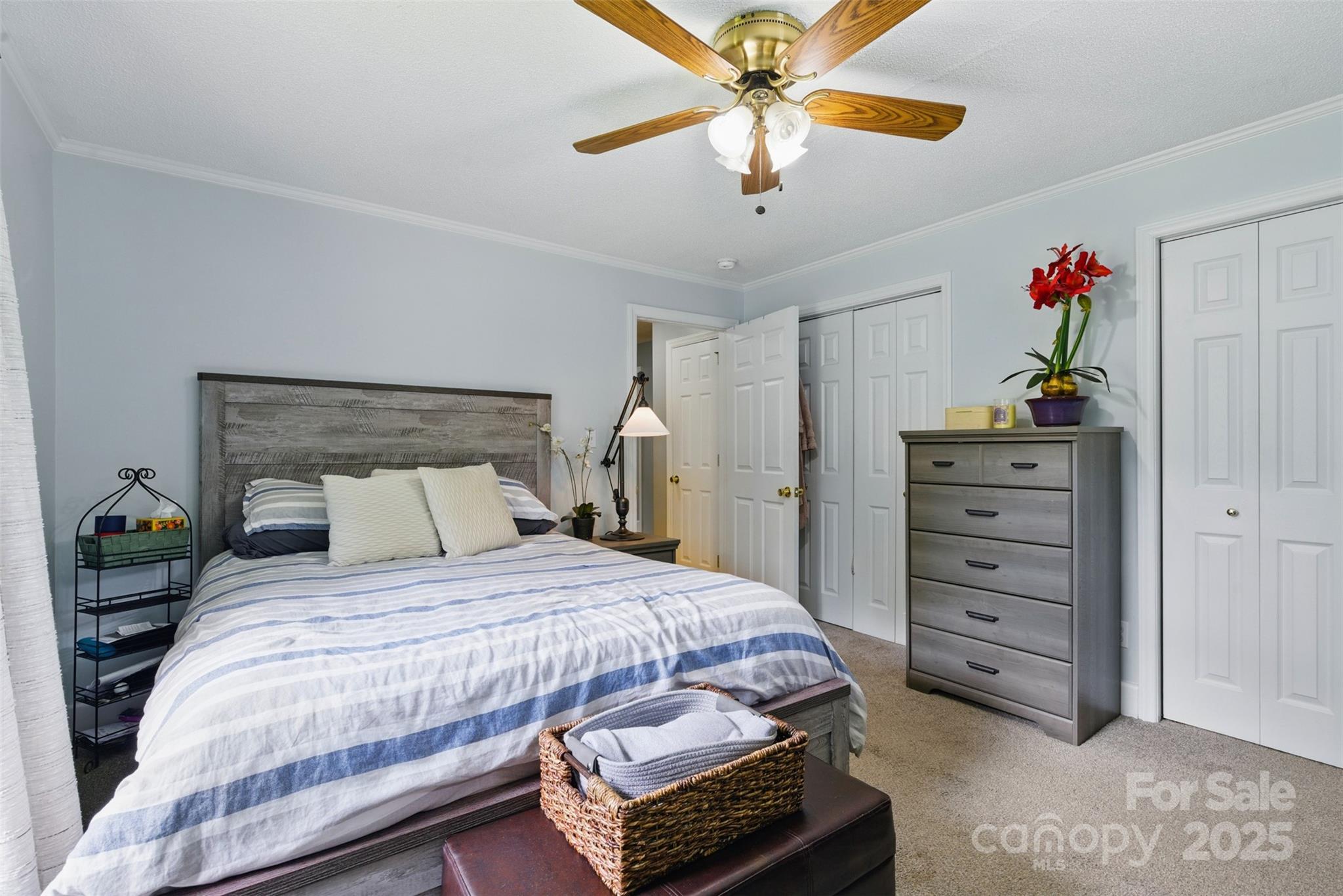 4230 Train Chaser Place Fort Mill, SC 29707 - Photo 7 of 31 a bedroom with a bed and a chandelier