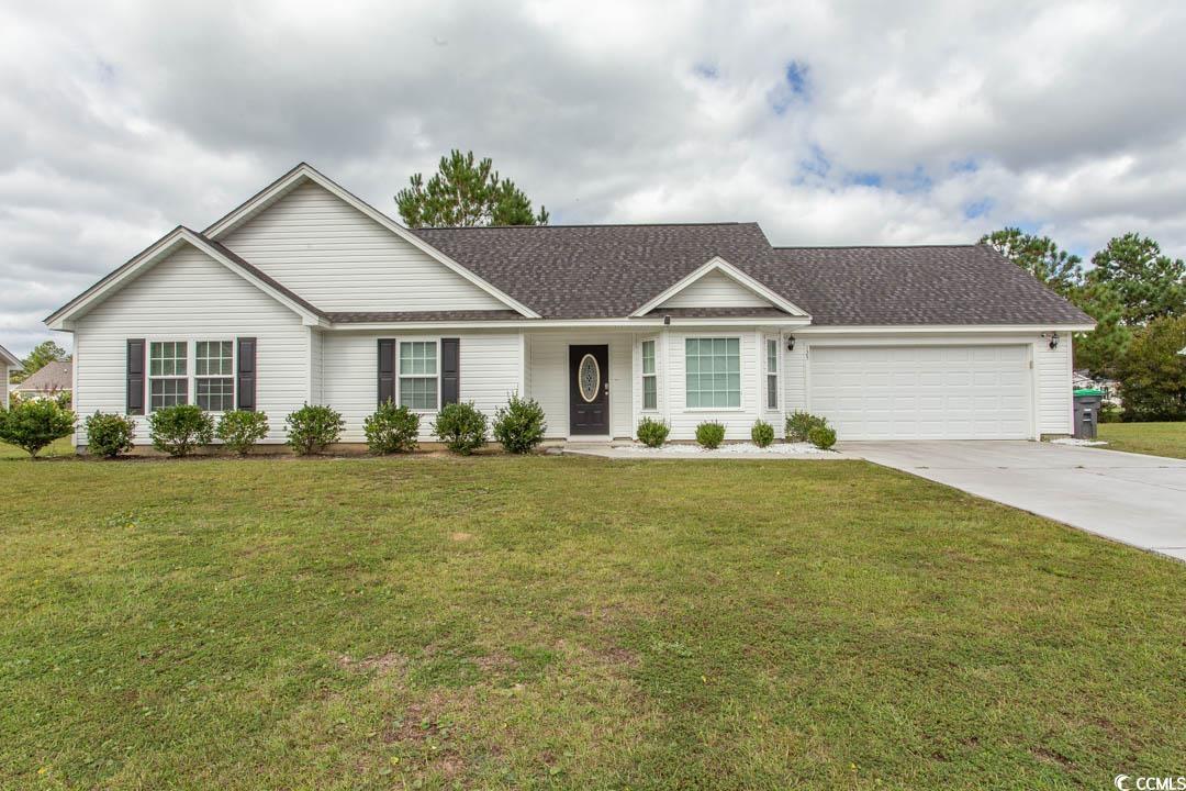 125 St Barnabus Road Loris, SC 29569 - Photo 1 of 39 Ranch-style house featuring a garage and a front y