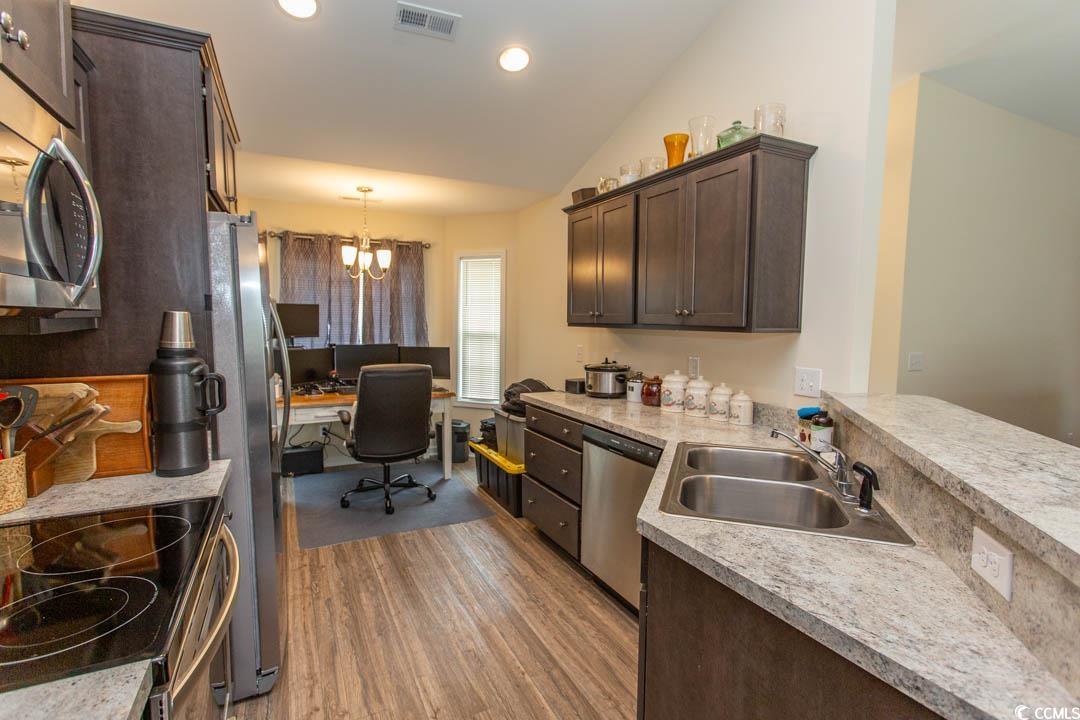 125 St Barnabus Road Loris, SC 29569 - Photo 15 of 39 Kitchen featuring sink, vaulted ceiling, stainless