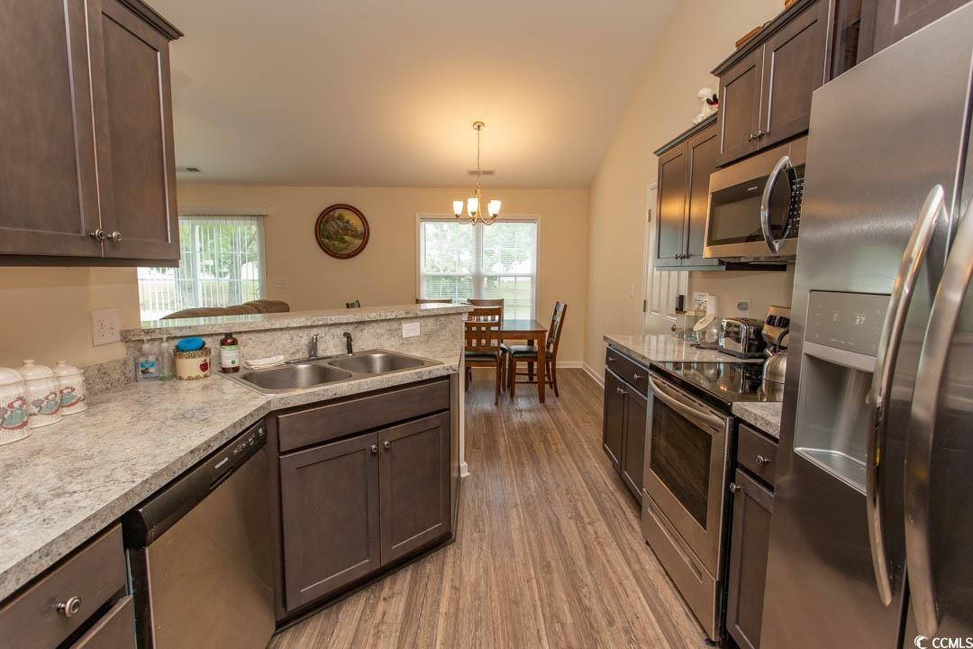 125 St Barnabus Road Loris, SC 29569 - Photo 17 of 39 Kitchen with sink, hardwood / wood-style floors, a