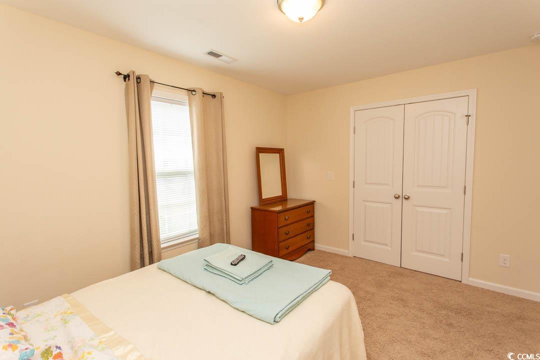 125 St Barnabus Road Loris, SC 29569 - Photo 29 of 39 Bedroom with light carpet and a closet