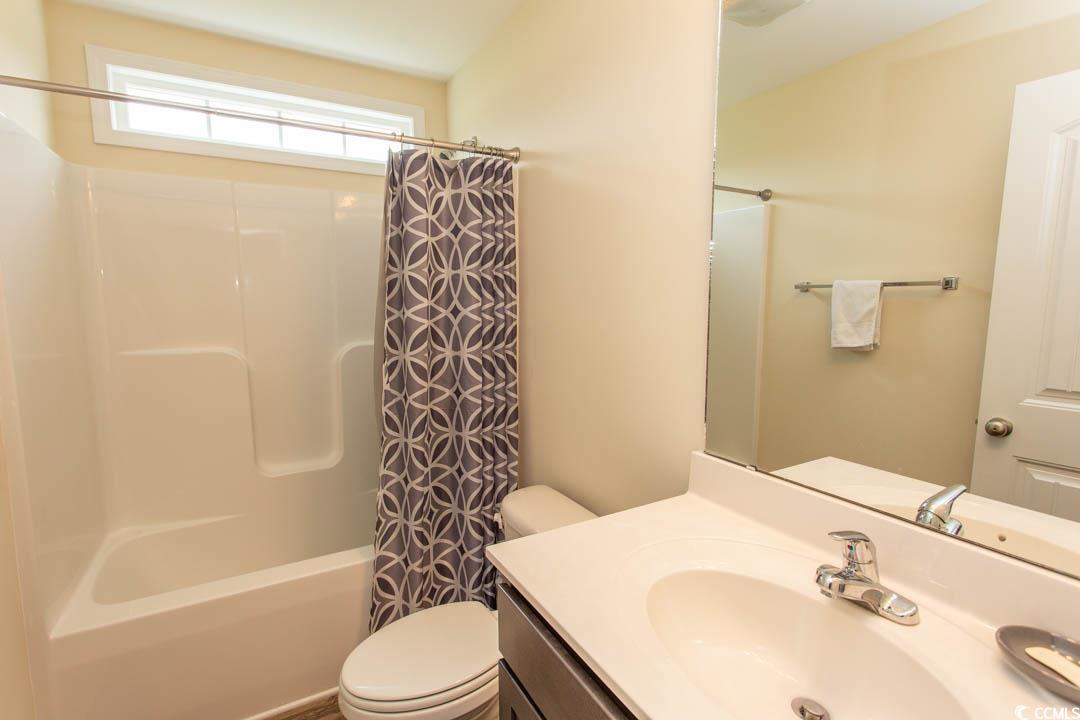 125 St Barnabus Road Loris, SC 29569 - Photo 31 of 39 Full bathroom with vanity, toilet, and shower / ba
