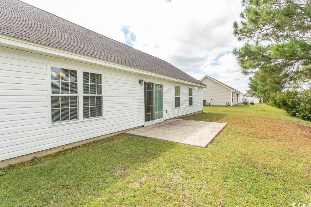 125 St Barnabus Road Loris, SC 29569 - Photo 5 of 39 Back of property featuring a patio area and a yard