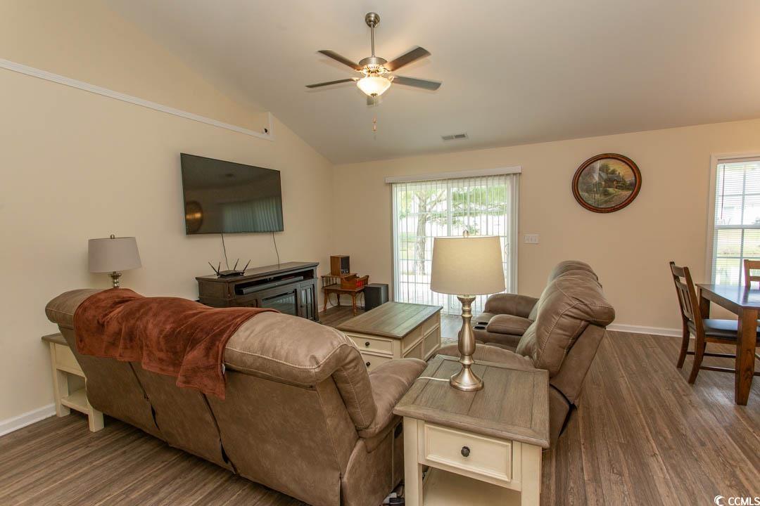 125 St Barnabus Road Loris, SC 29569 - Photo 8 of 39 Living room featuring ceiling fan, dark hardwood /