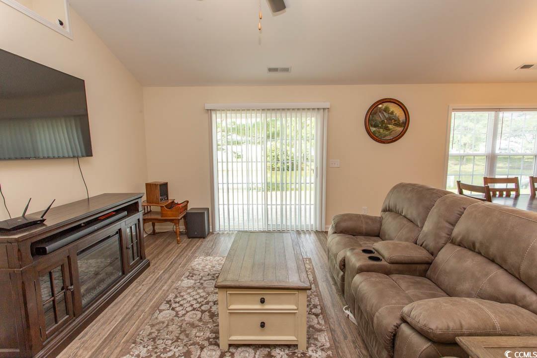 125 St Barnabus Road Loris, SC 29569 - Photo 9 of 39 Living room featuring ceiling fan, light hardwood