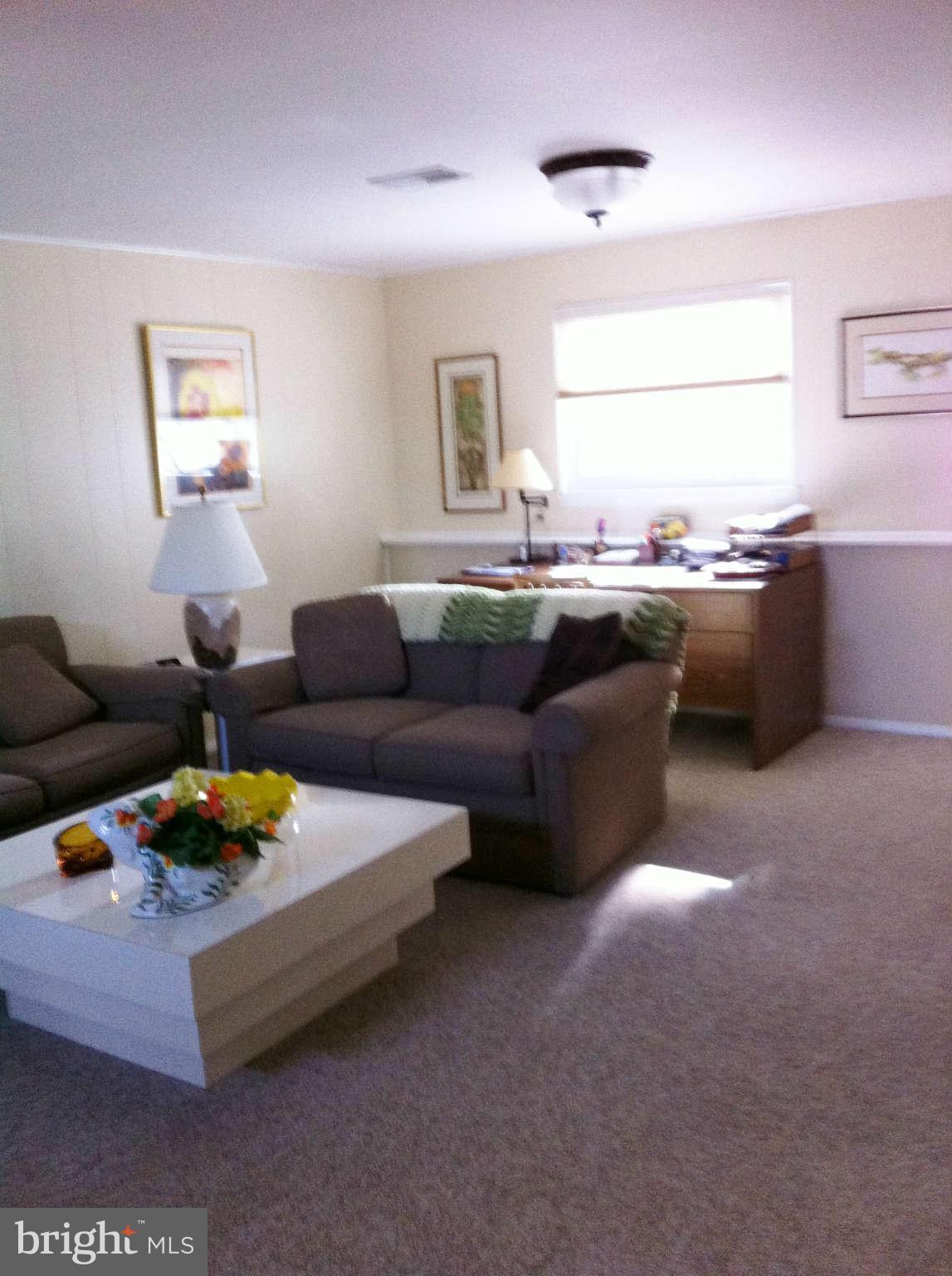 3900 Setonhurst Road Baltimore, MD 21208 - Photo 11 of 20 a living room with furniture and window