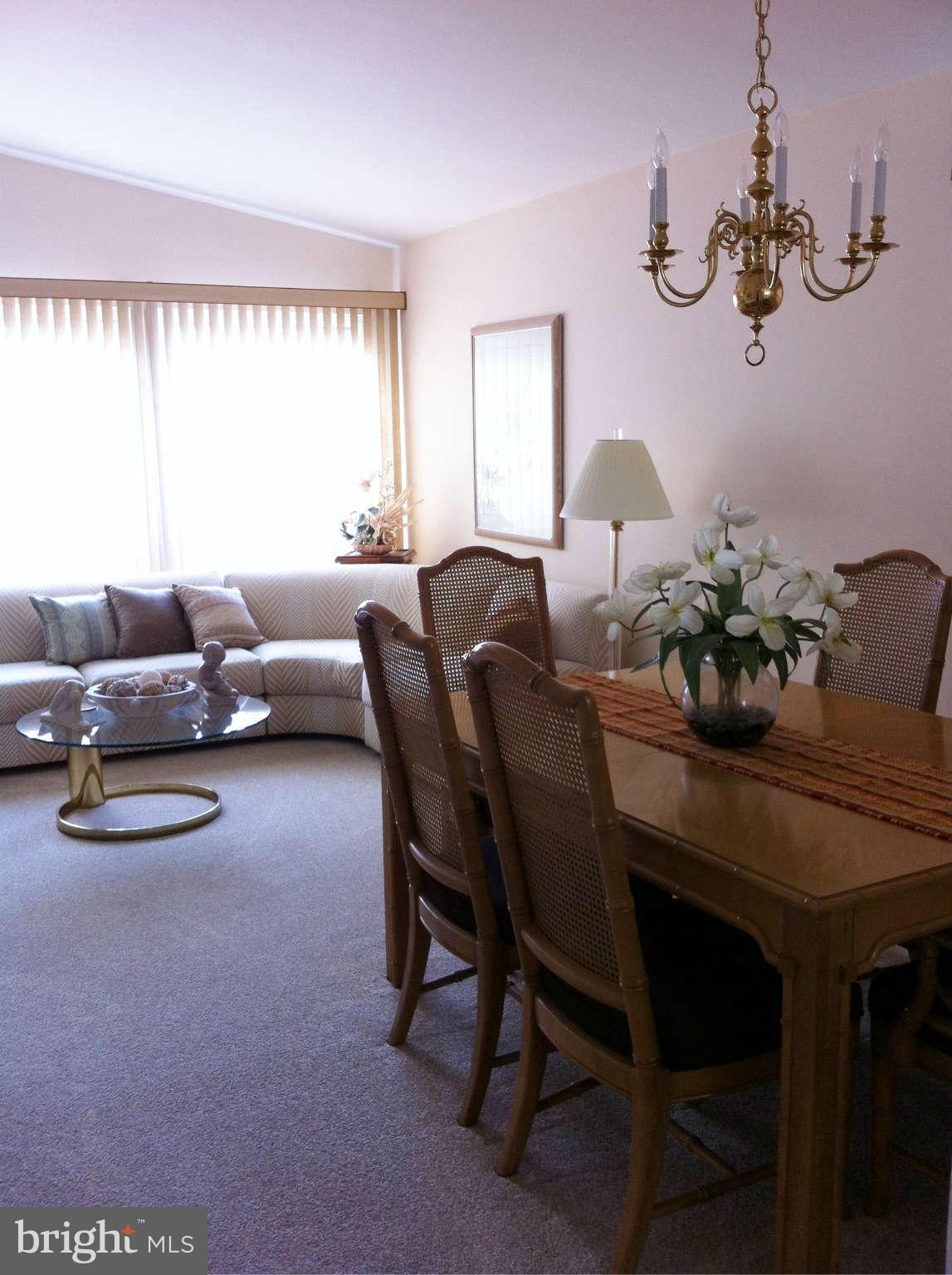 3900 Setonhurst Road Baltimore, MD 21208 - Photo 14 of 20 a living room with furniture and a large window
