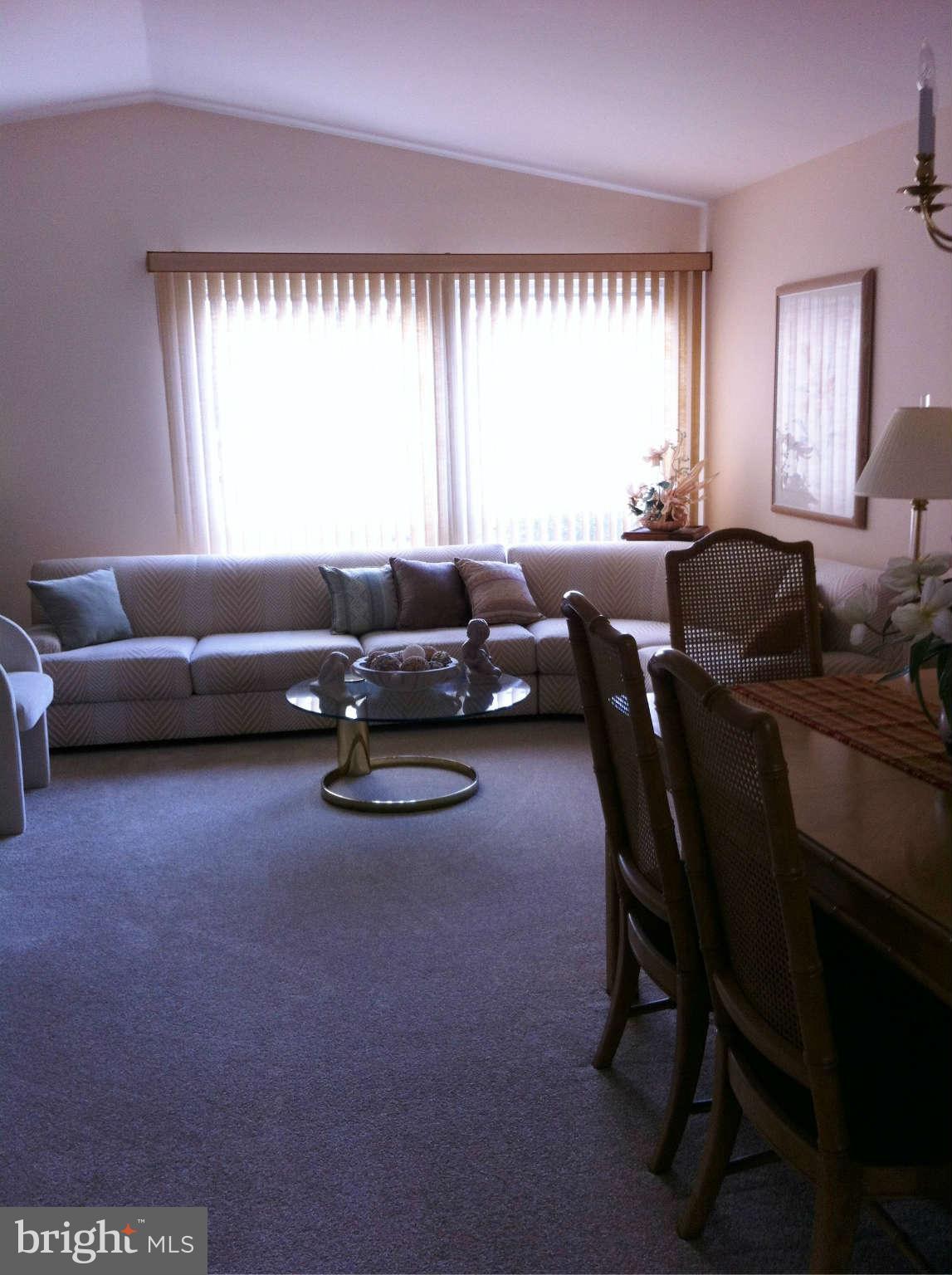 3900 Setonhurst Road Baltimore, MD 21208 - Photo 17 of 20 a living room with furniture and a large window