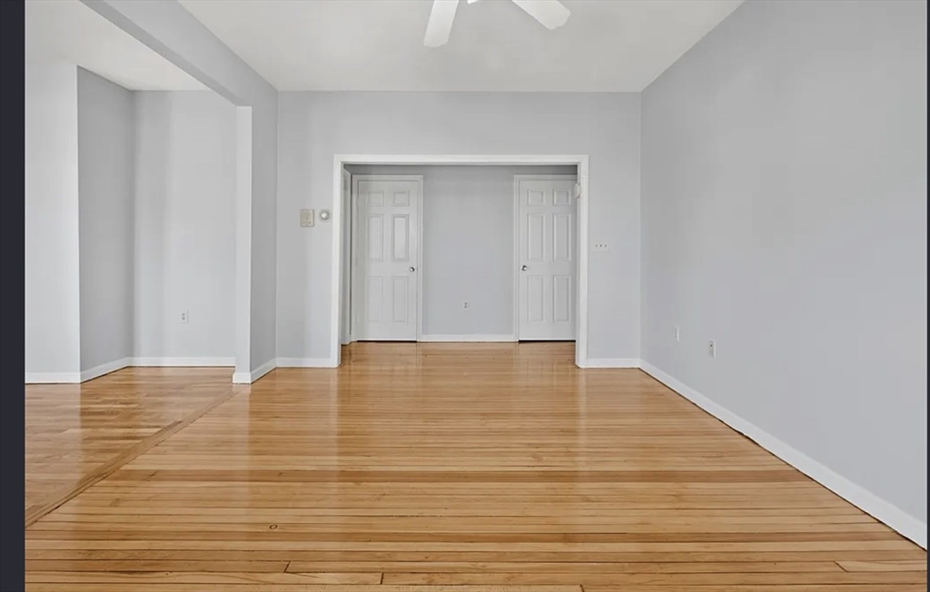 61 Shurtleff Street, Unit 4 Chelsea, MA 02150 - Photo 11 of 22 a view of an empty room with wooden floor