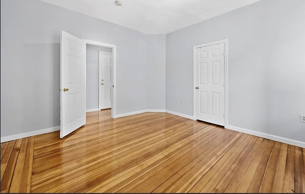 61 Shurtleff Street, Unit 4 Chelsea, MA 02150 - Photo 12 of 22 a view of empty room with wooden floor