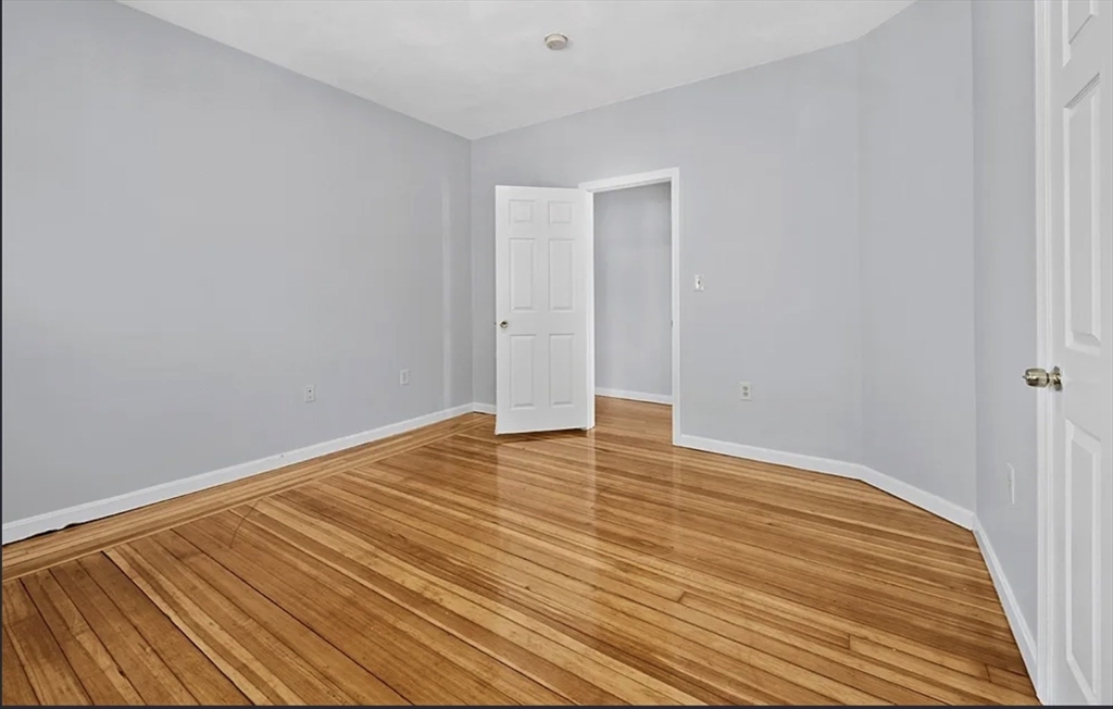 61 Shurtleff Street, Unit 4 Chelsea, MA 02150 - Photo 14 of 22 a view of empty room with wooden floor