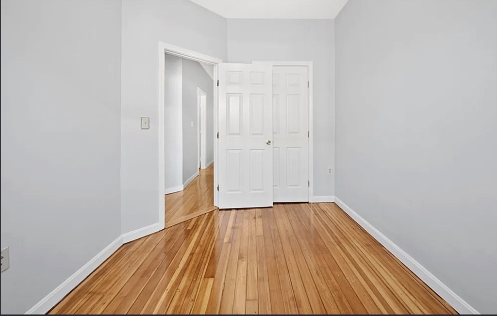 61 Shurtleff Street, Unit 4 Chelsea, MA 02150 - Photo 19 of 22 a view of a room with wooden floor