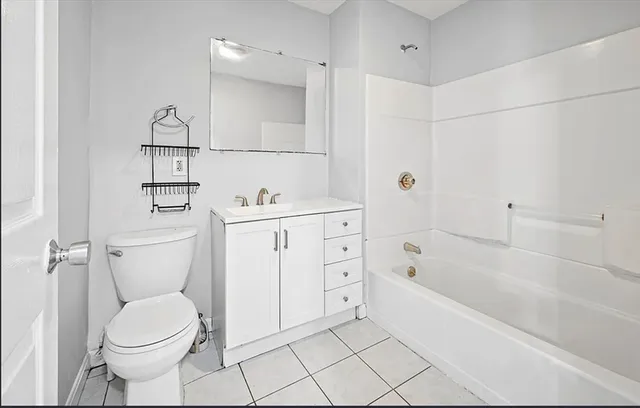 a bathroom with a sink toilet and bathtub
