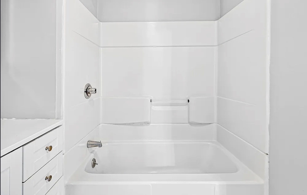 61 Shurtleff Street, Unit 4 Chelsea, MA 02150 - Photo 21 of 22 a close up of a bathtub