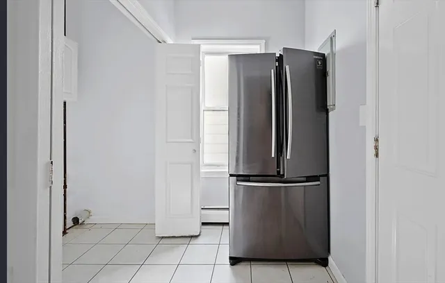a view of a refrigerator in kitchen
