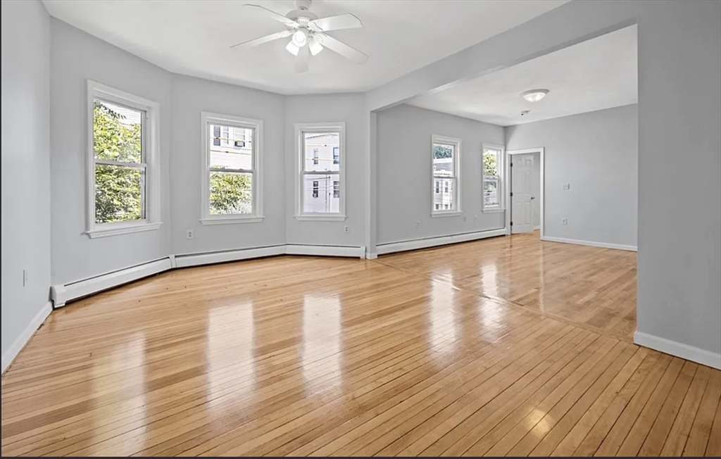 61 Shurtleff Street, Unit 4 Chelsea, MA 02150 - Photo 6 of 22 a view of empty room with wooden floor and fan