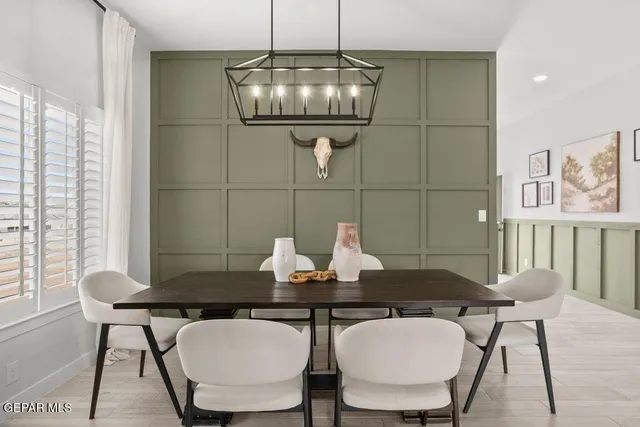 a view of a dining room with furniture and window