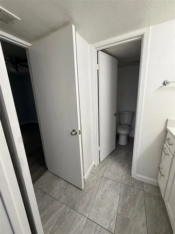 a bathroom with a toilet and a bathtub