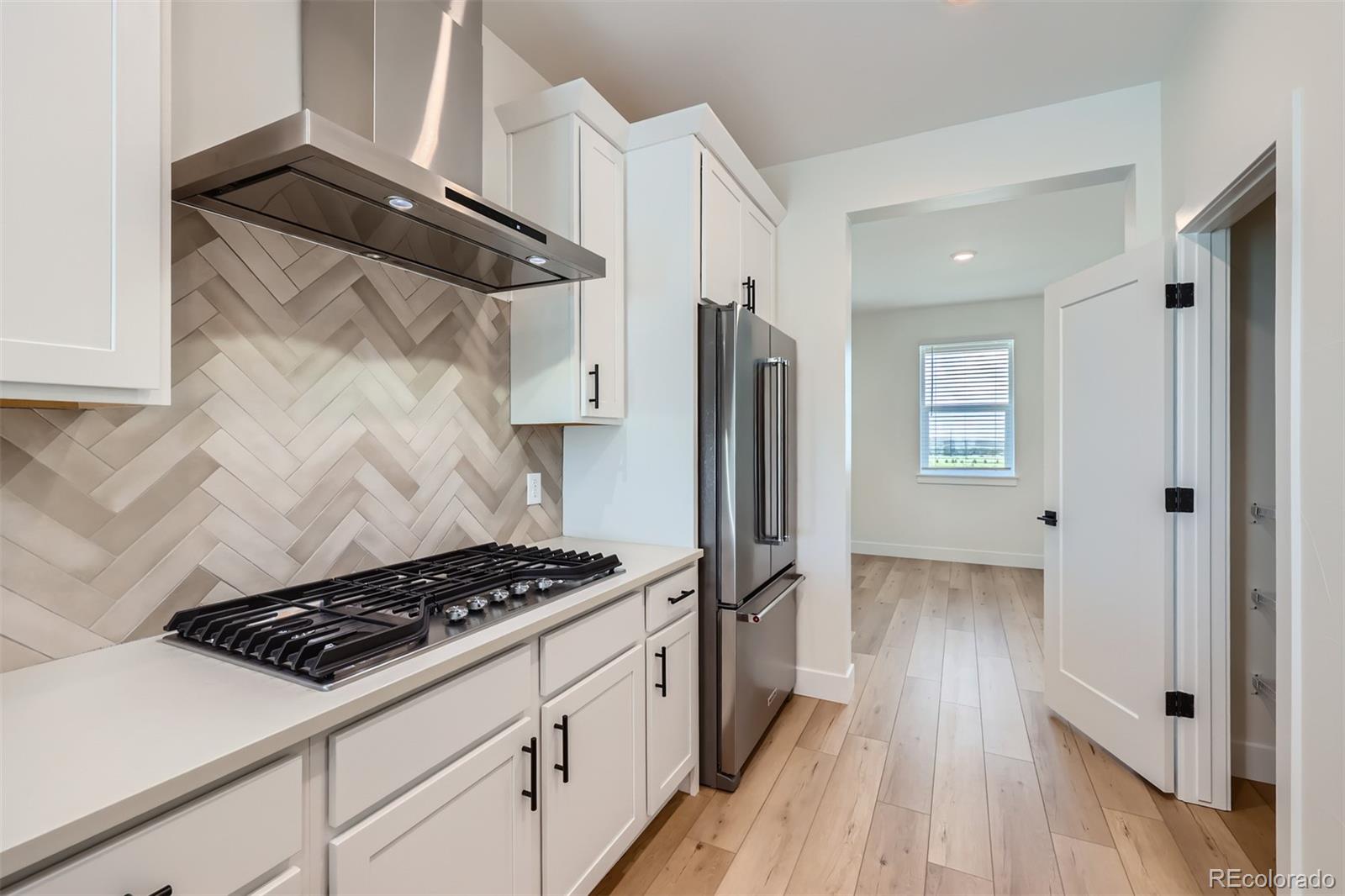 42982 Colonial Trail Elizabeth, CO 80107 - Photo 11 of 31 a kitchen with stainless steel appliances granite countertop a refrigerator and a stove