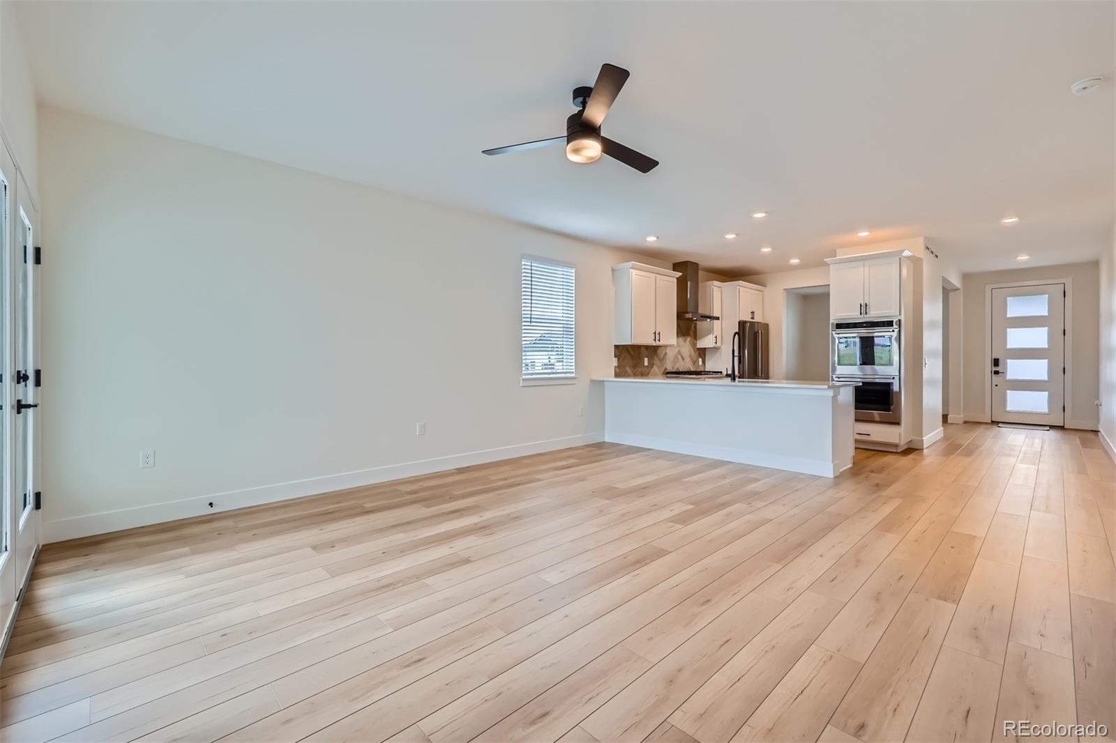 42982 Colonial Trail Elizabeth, CO 80107 - Photo 13 of 31 a view of a kitchen with a sink and wooden floor