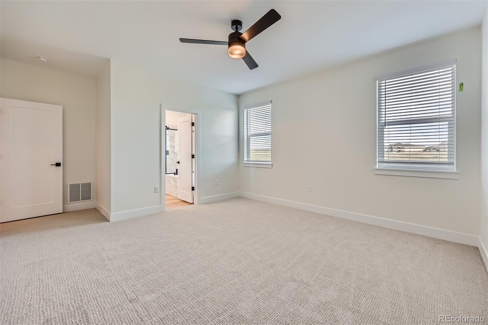 42982 Colonial Trail Elizabeth, CO 80107 - Photo 17 of 31 an empty room with windows and fan