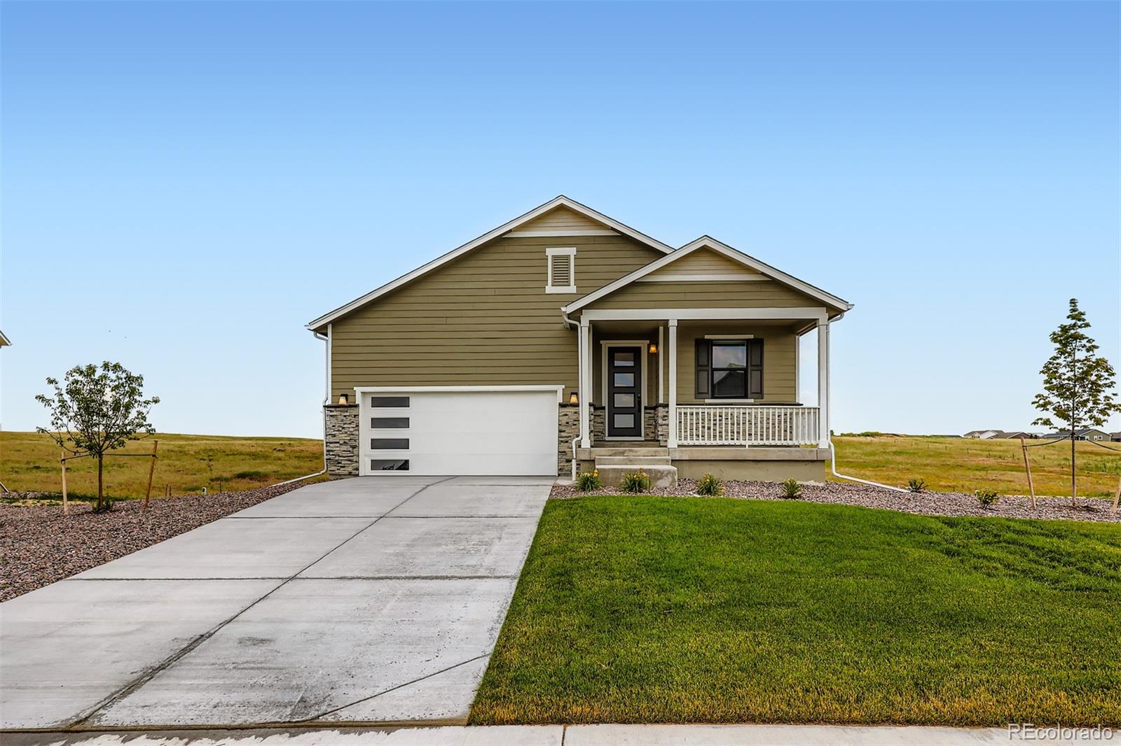 42982 Colonial Trail Elizabeth, CO 80107 - Photo 2 of 31 a front view of a house with a yard