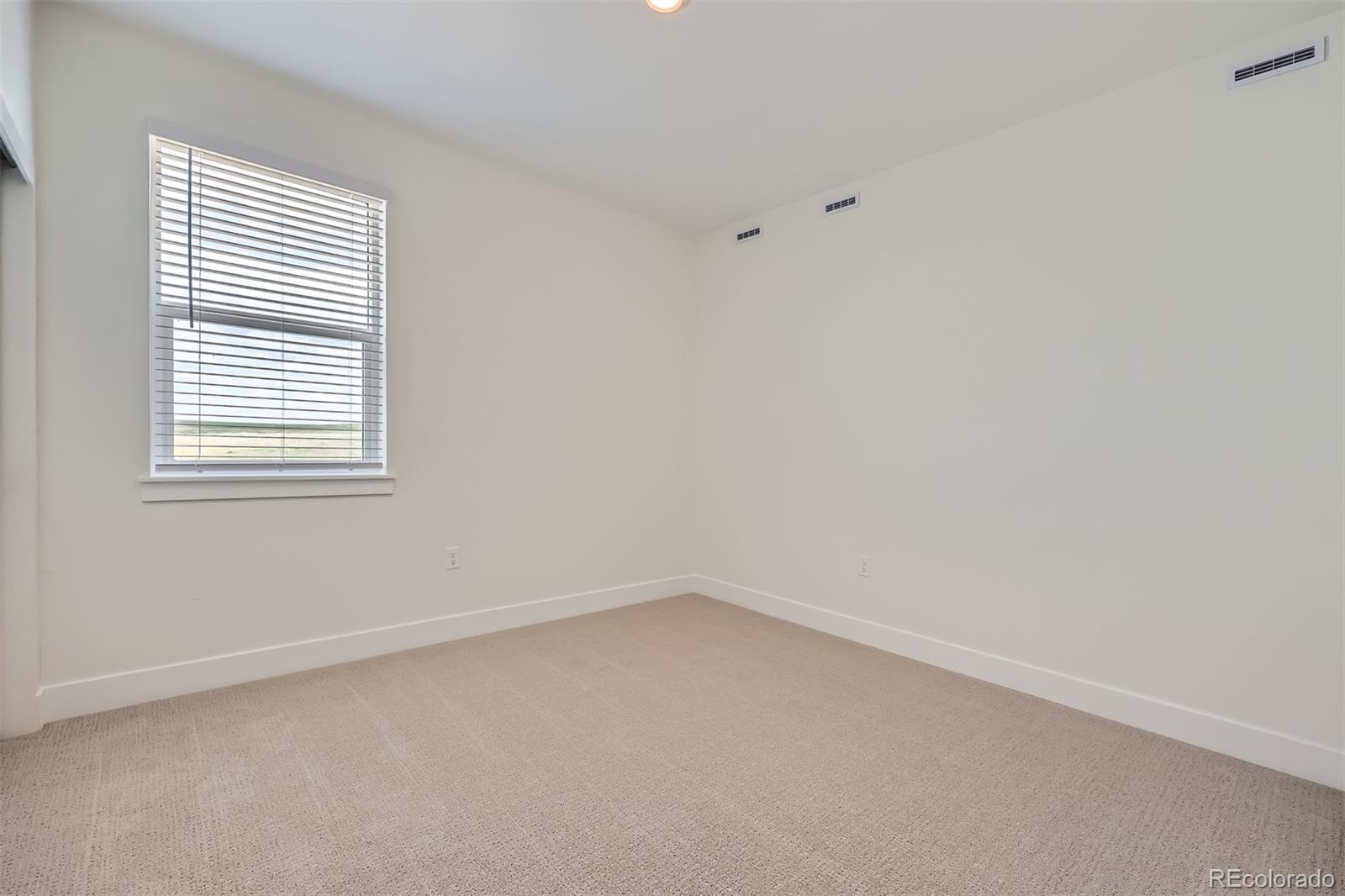 42982 Colonial Trail Elizabeth, CO 80107 - Photo 21 of 31 an empty room with a window