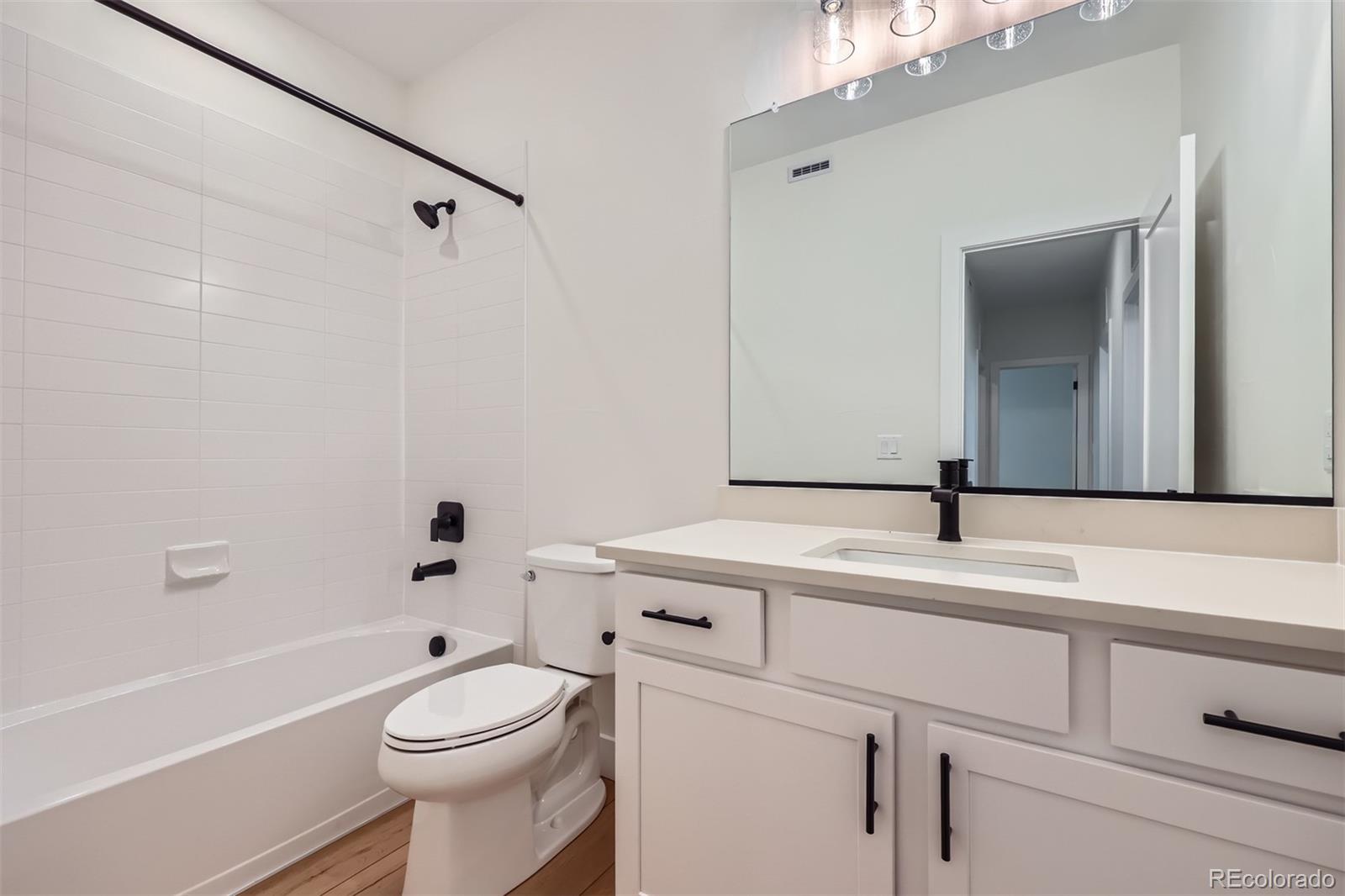 42982 Colonial Trail Elizabeth, CO 80107 - Photo 24 of 31 a bathroom with a sink a toilet and a bathtub