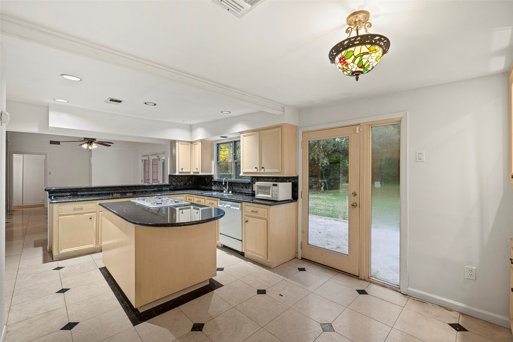2927 Rockyridge Drive Houston, TX 77063 - Photo 11 of 34 a kitchen with a stove a refrigerator and a sink