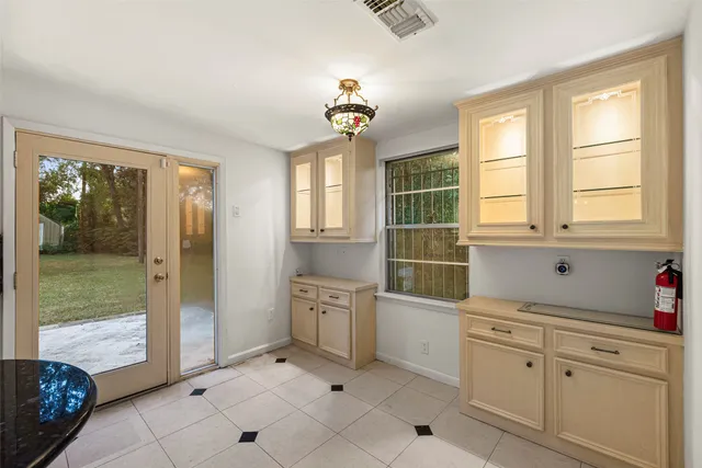 a bathroom with a tub sink and glass door