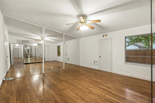 a view of a livingroom with wooden floor