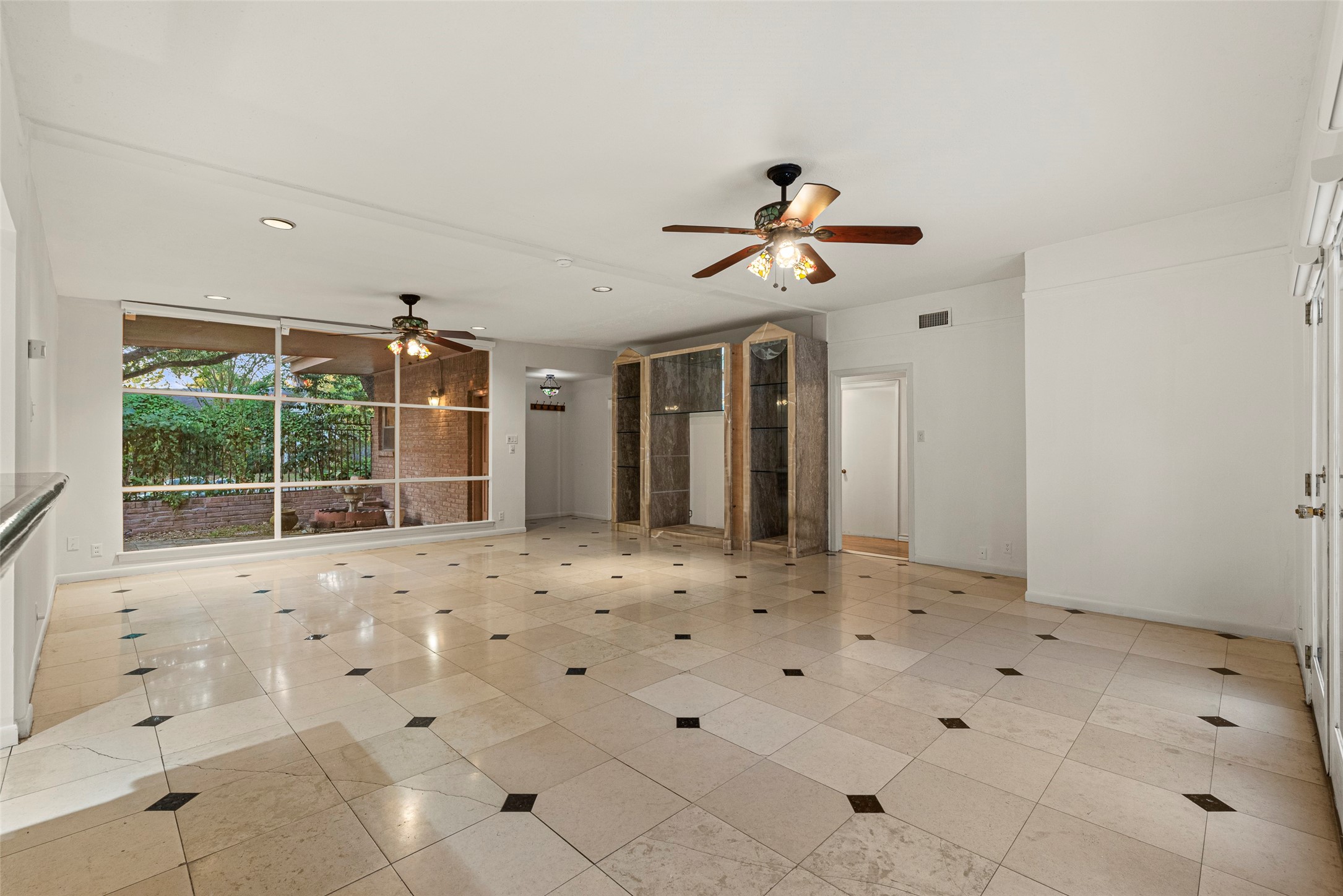 2927 Rockyridge Drive Houston, TX 77063 - Photo 6 of 34 a view of an empty room with a window